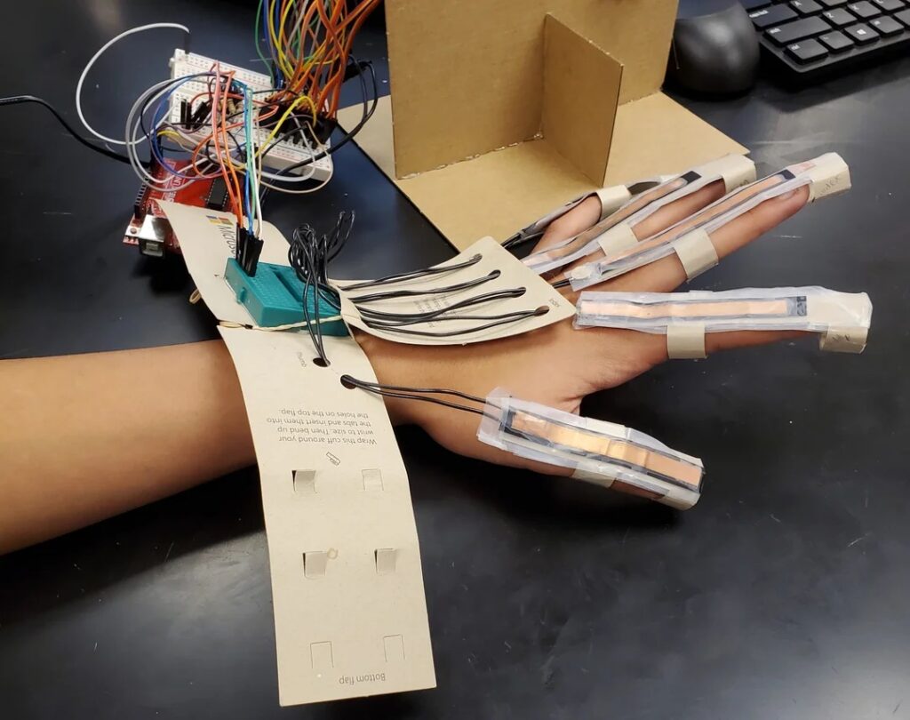 Students utilize Arduinos to build a hand with sensors. 