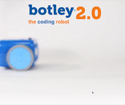 A botley 2.0 robot rolls into the gif and up closer to the camera, demonstrates its glow-in-the-dark features, and rolls back out of the square. 