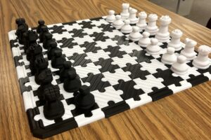 A 3D printed black and white chess board.