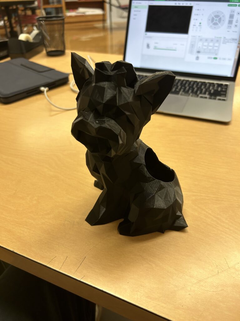 A 3D printed dog made by a student in the middle school makerspace. 