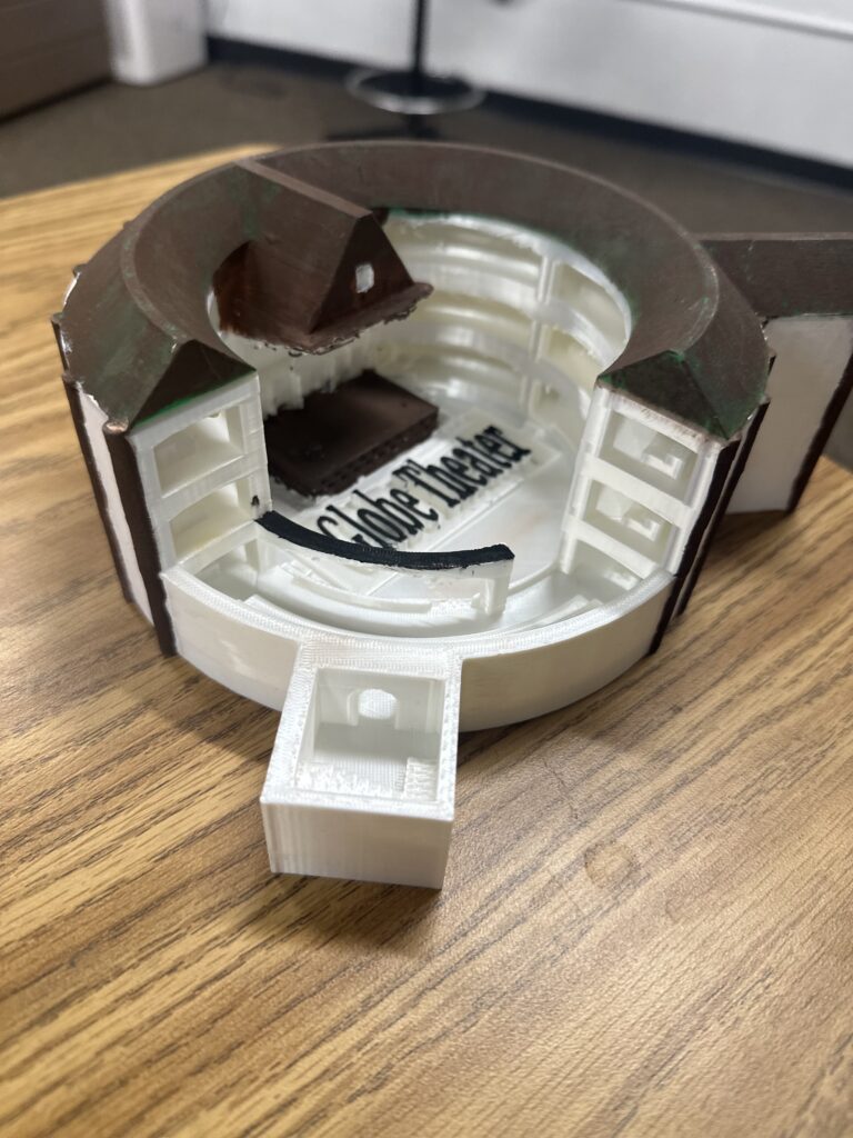 A 3D-printed Globe Theater, which is partially cut open to show the interior. 