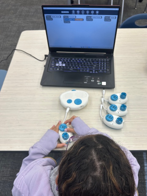 A student works with a Code Jumper in their classroom.