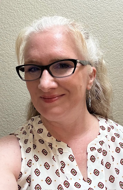 A headshot of educator Christina Adamson smiling. 