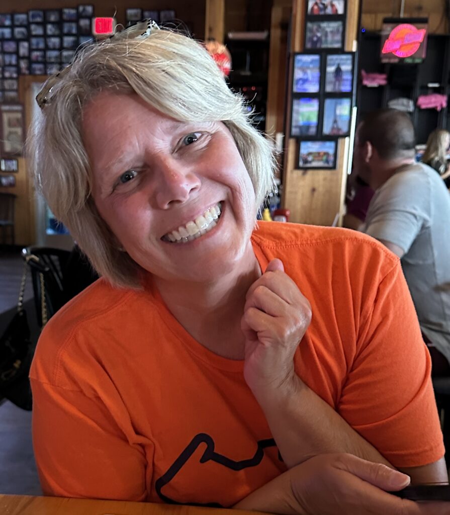 A photo of librarian Amy Gourlay smiling in a restaurant. 
