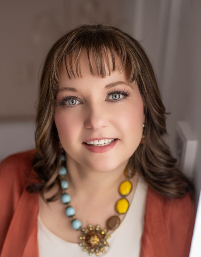 A photo of media specialist Christa Bell smiling. 