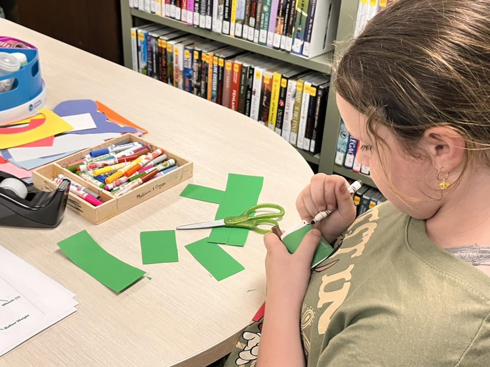 A student works on decorating their Sphero component.