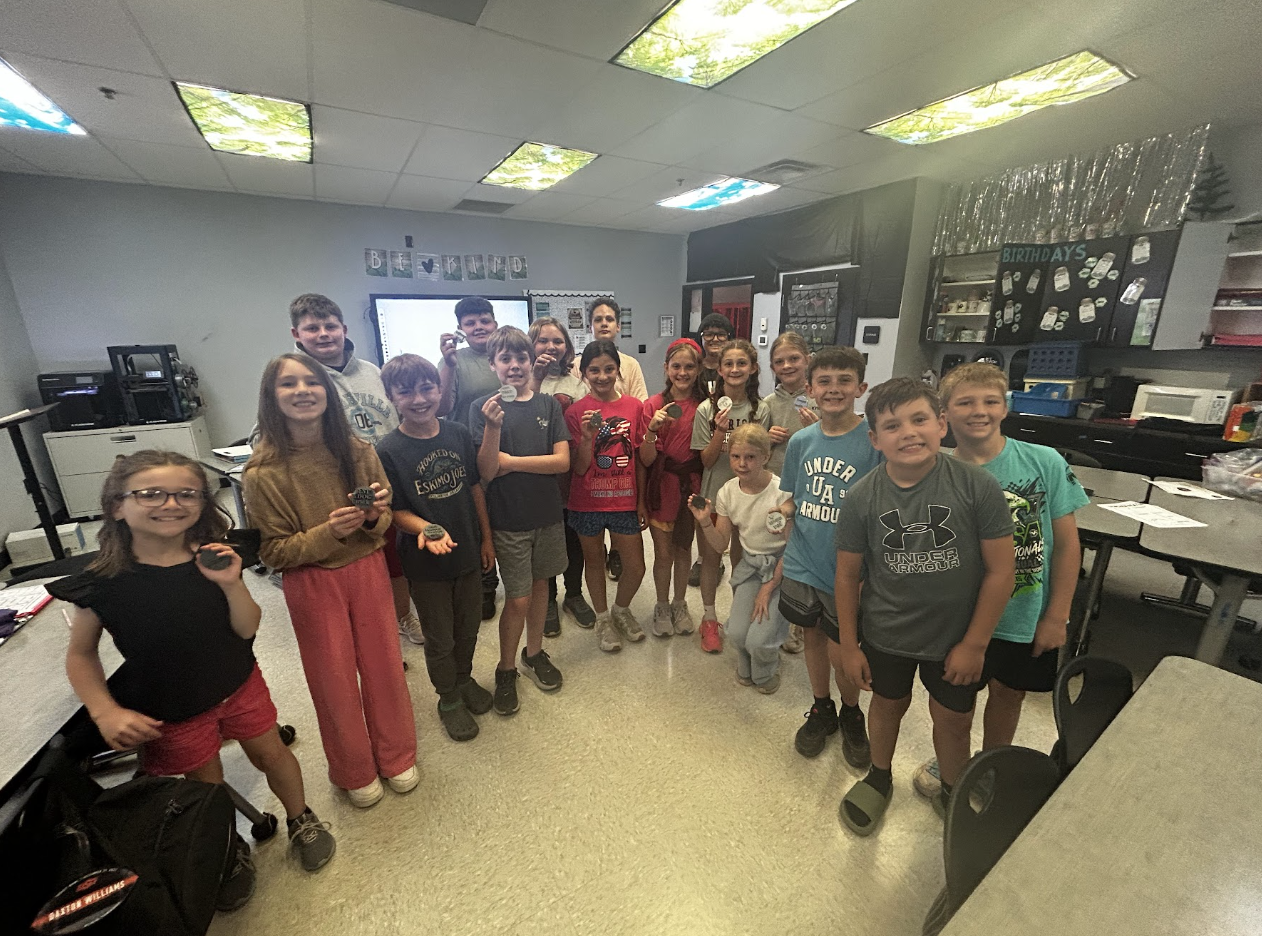 Tiffanie's students post with their 3D printed creations.