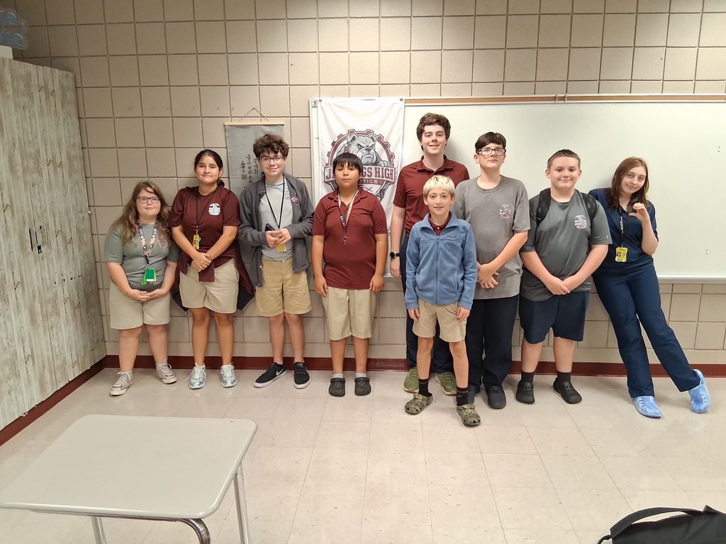 The robotics team members pose together for a group photo.