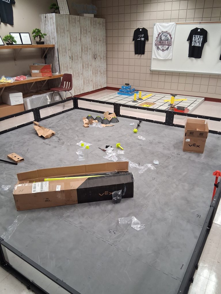 Mr. Romine's classroom, complete with a mat, boxes, and various wrappings covering the floor.